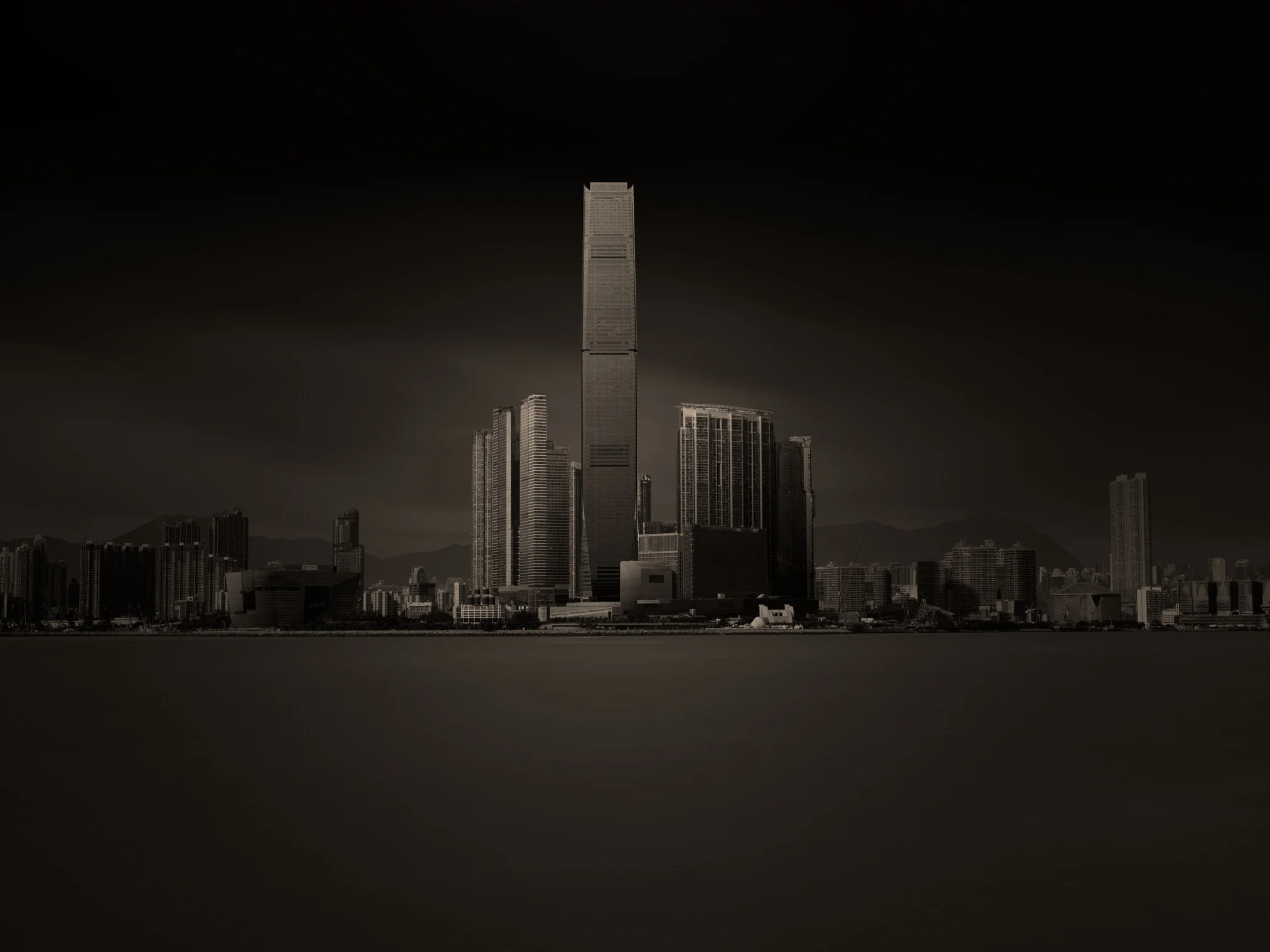 Hong Kong residential towers rising above a green hillside