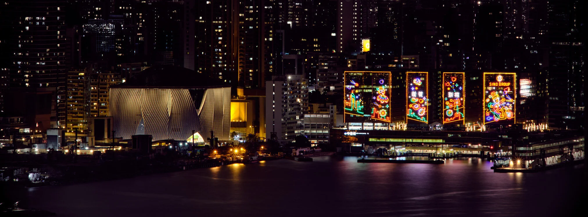 Hong Kong skyline at dusk under dramatic clouds